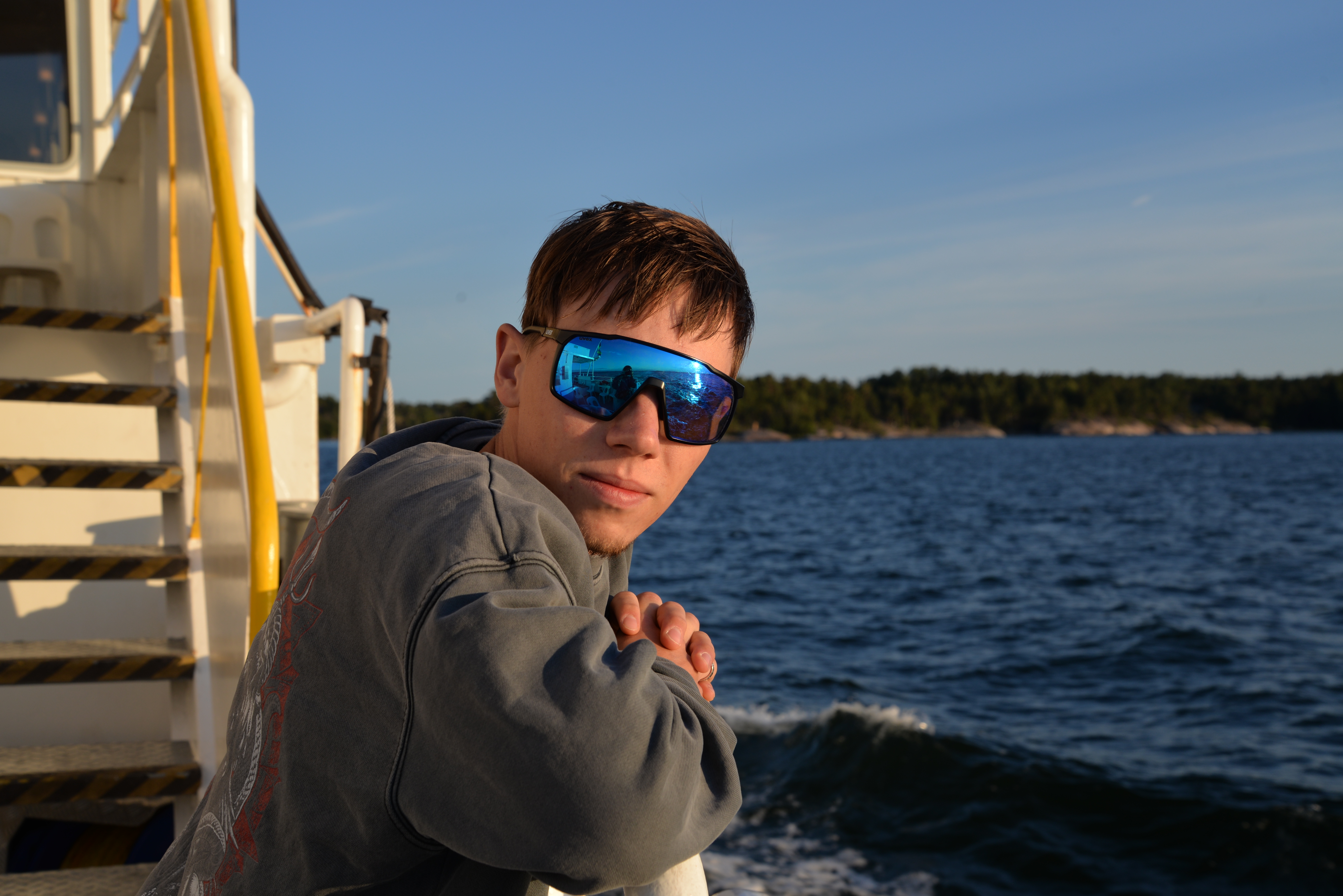 Portrait of Yanik Wüthrich on a boat